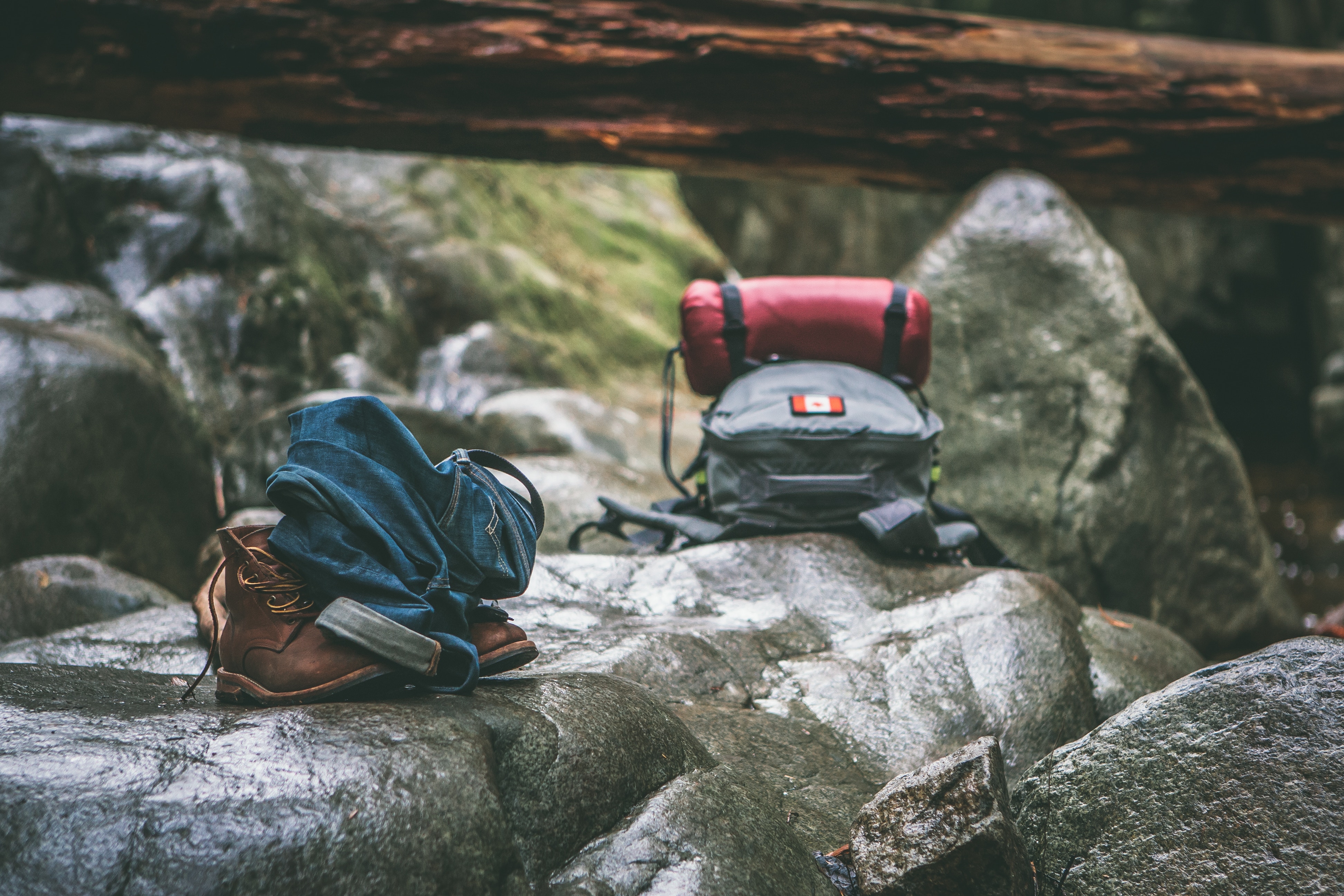Two backpacks, laying on the rocks